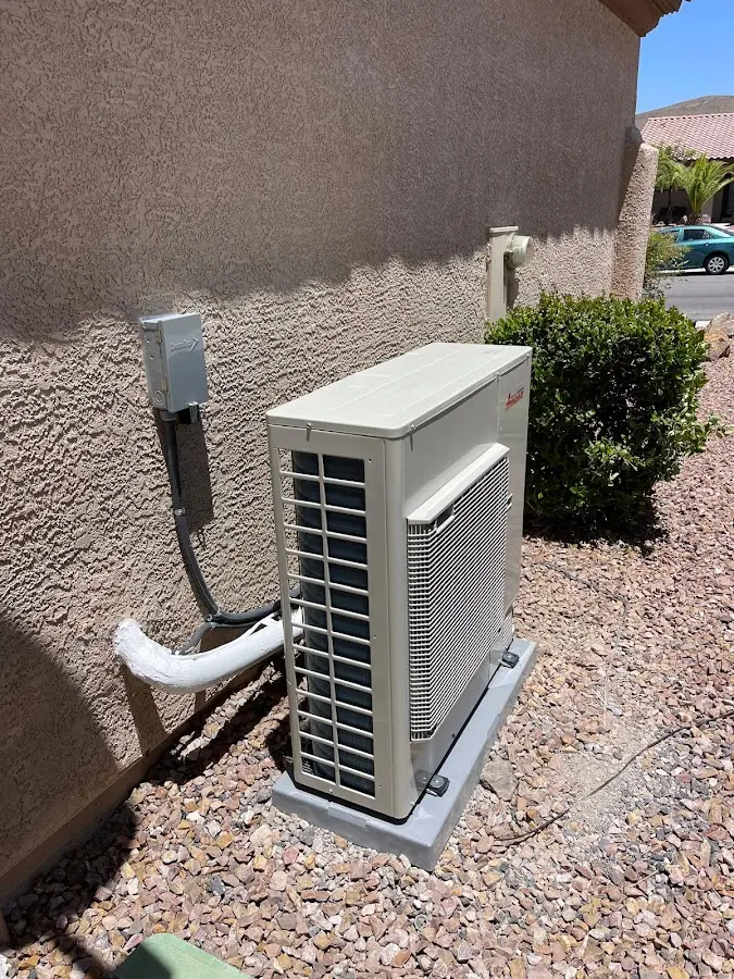 Residential air conditioning condenser unit in Willington